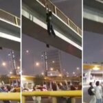 Joven ebrio se cuelga de un puente por diversión, pero el final no salió como esperaba (VIDEO)